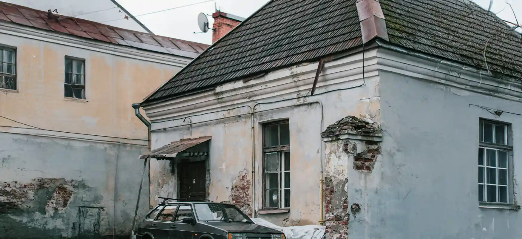 Damaged House With Car