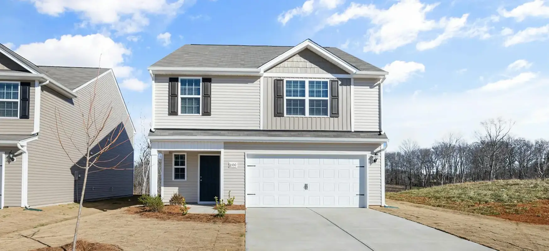 Gray Wooden House With Driveway